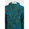 Green turtleneck sweater with a printed pattern