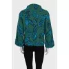 Green turtleneck sweater with a printed pattern