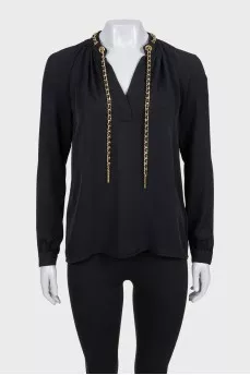 Black loose-fitting blouse with decoration