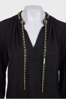 Black loose-fitting blouse with decoration
