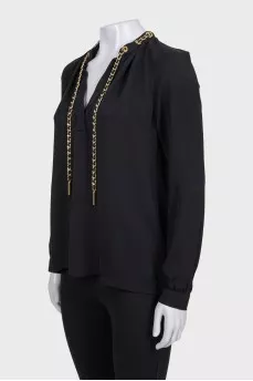 Black loose-fitting blouse with decoration