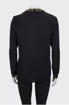 Black loose-fitting blouse with decoration