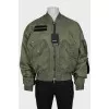 Men's green bomber jacket with tag