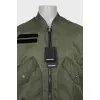 Men's green bomber jacket with tag