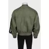 Men's green bomber jacket with tag