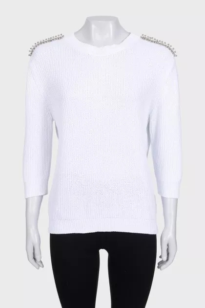 White sweater with shoulder embellishments