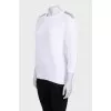 White sweater with shoulder embellishments