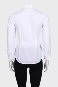 White blouse decorated with ruffles