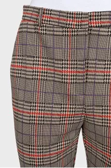Beige tapered trousers with a plaid print