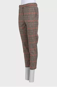 Beige tapered trousers with a plaid print