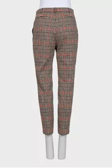 Beige tapered trousers with a plaid print