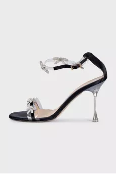 Black sandals decorated with bows