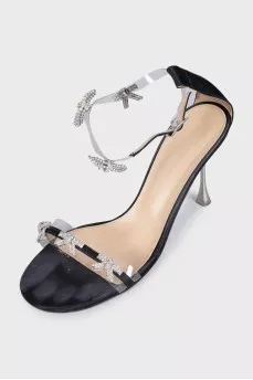 Black sandals decorated with bows