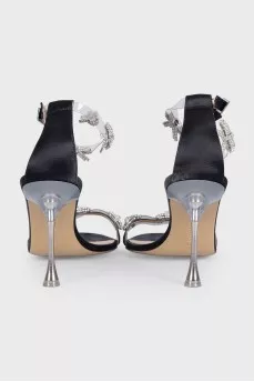 Black sandals decorated with bows