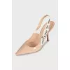 Beige slingbacks with the J'Adior logo