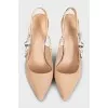 Beige slingbacks with the J'Adior logo