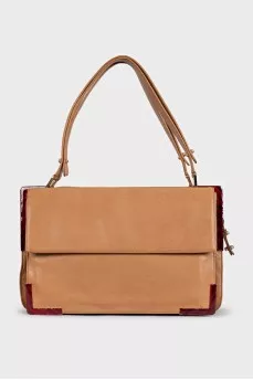 Leather shoulder bag with metal decor