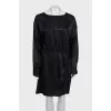 Black dress with a cutout back and draping