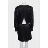 Black dress with a cutout back and draping