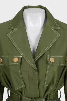 A short, fitted coat with buttons
