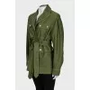 A short, fitted coat with buttons