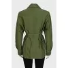 A short, fitted coat with buttons