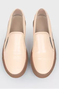 Leather moccasins with brown soles