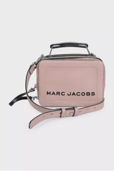 Beige leather bag with black logo