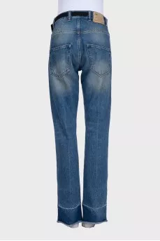 High-waisted blue jeans with a distressed effect