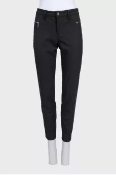 Black tapered trousers with a mid-rise