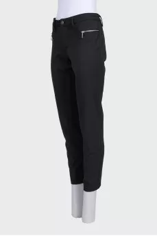 Black tapered trousers with a mid-rise