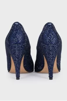 Blue suede shoes decorated with rhinestones