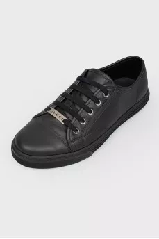 Black leather sneakers on lacing