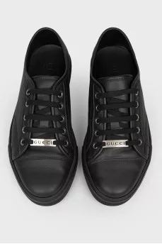 Black leather sneakers on lacing