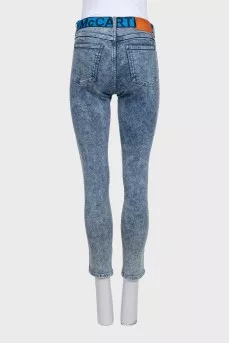 Blue jeans with a signature print
