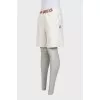 Men's beige shorts with a signature print
