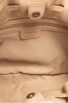 Beige fabric bag with a branded pendant