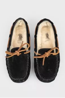 Insulated black moccasins on fur