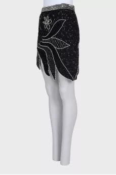 Mini skirt decorated with beads