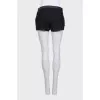 Black shorts with leather inserts