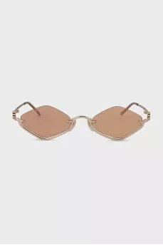 Sunglasses with a shaped frame in gold color