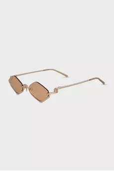 Sunglasses with a shaped frame in gold color