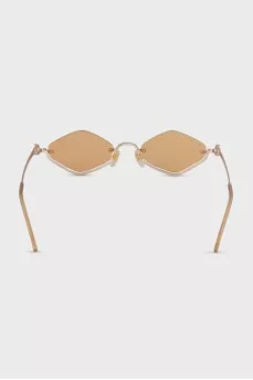 Sunglasses with a shaped frame in gold color