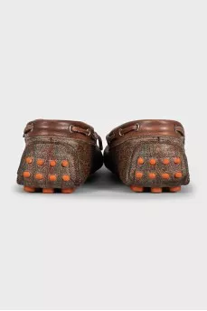 Brown leather moccasins with print
