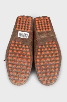 Brown leather moccasins with print