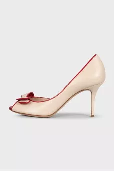 Beige leather shoes with red trim