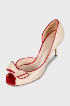 Beige leather shoes with red trim