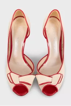 Beige leather shoes with red trim