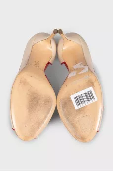 Beige leather shoes with red trim