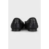Black quilted leather ballet flats